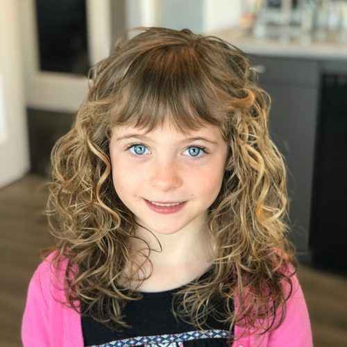 Shoulder-Length Curly Cut with Rounded Bangs